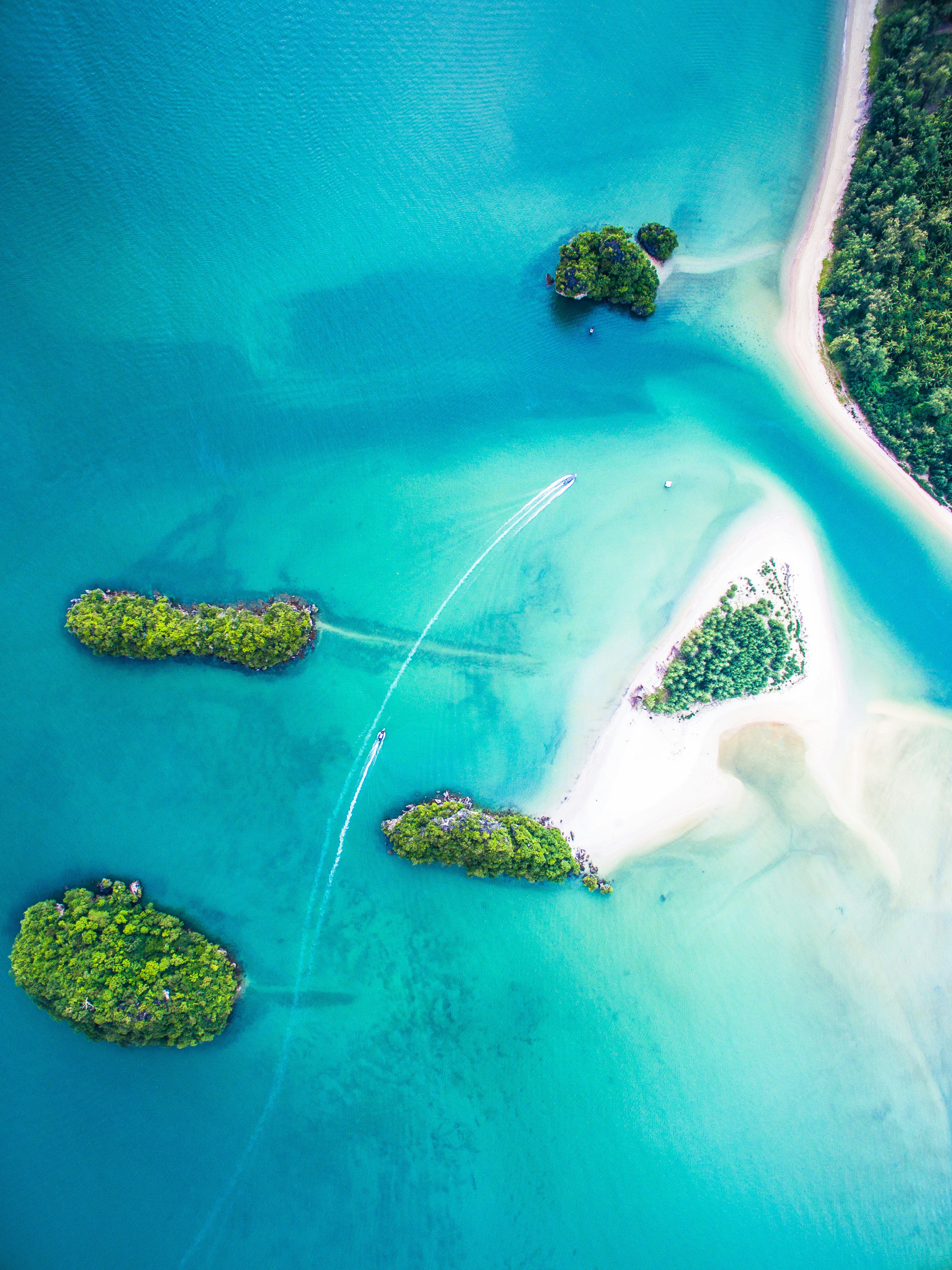 This photo was shot with my DJI Phantom 3 in Thailand, Krabi in 2016. It’s possible to get to the Sirithan Beach (sandy island) walking from the mainland (more right) in the water. The maximum depth in the most shallow path is waist-high. A little inconvenience totally worth it because the beach is almost empty and feels like a paradise.